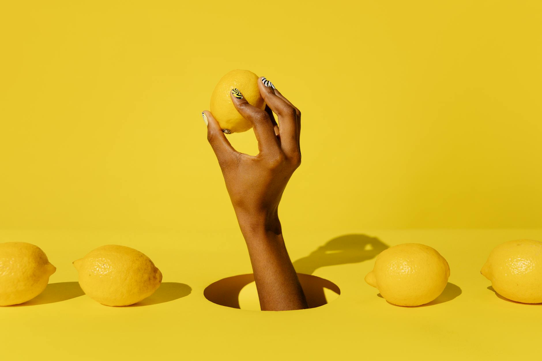 Person holding two colorful clitoral vibrators, representing choice and individual anatomy