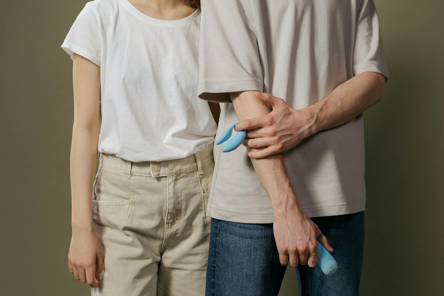 A young couple standing together indoors, symbolizing modern intimacy and partnership